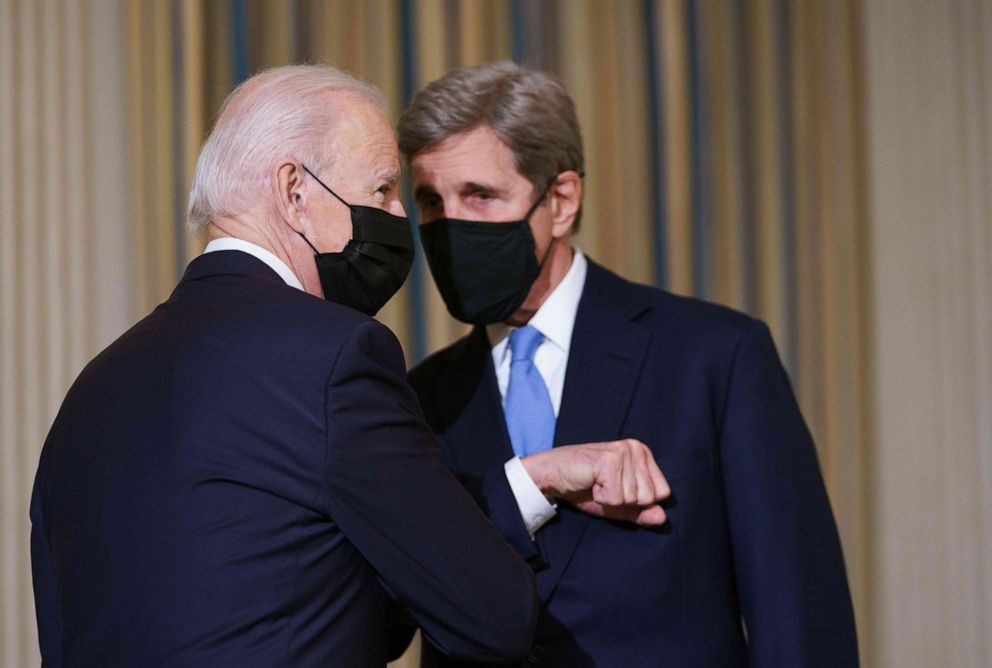 PHOTO: President Joe Biden greets Special Presidential Envoy for Climate John Kerry as he arrives to speak on climate change before signing executive orders in the State Dining Room of the White House in Washington, D.C., Jan. 27, 2021.