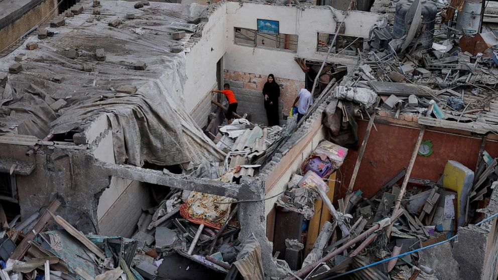 PHOTO: Palestinians check the damage at the site of Israeli strikes on houses in Khan Younis in the southern Gaza Strip, Oct. 29, 2023.