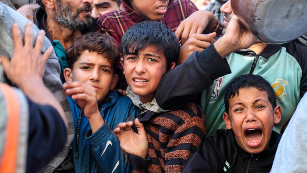 PHOTO: Palestinians line up for food in Rafah, Gaza Strip, Nov. 30, 2023, during a temporary ceasefire between Israel and Hamas. 